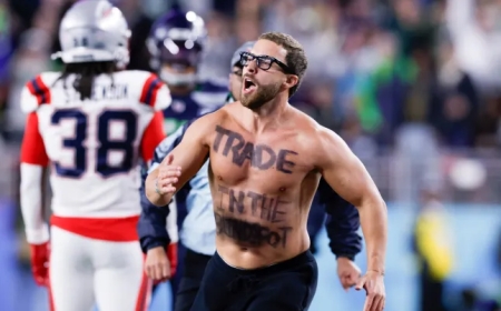 Super Bowl streaker displaying cryptic message taken down by New England Patriots star